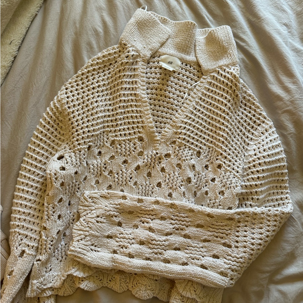 Cream top with cutouts